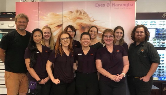 get contact lenses online team posing for group photo in their store 